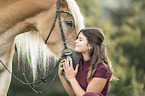 woman and Haflinger