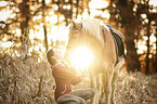 woman and Haflinger