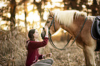 woman and Haflinger