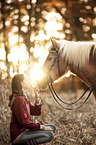 woman and Haflinger