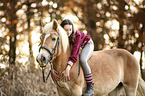woman rides Haflinger