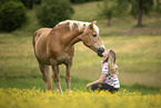 woman and Haflinger