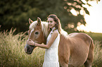 woman and Haflinger