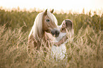 woman and Haflinger