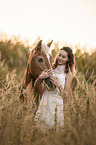 woman and Haflinger