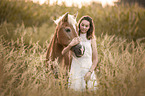 woman and Haflinger