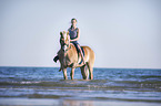 woman rides Haflinger