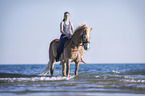 woman rides Haflinger
