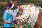 woman and Haflinger
