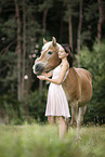 woman and Haflinger horse