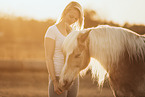 woman and Haflinger horse