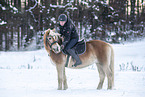 woman and Haflinger horse