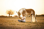 woman and Haflinger horse
