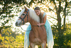 woman and Haflinger horse