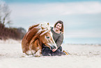 woman and Haflinger horse