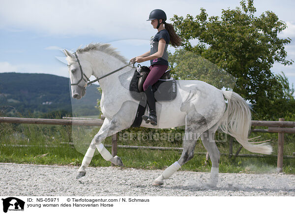 young woman rides Hanoverian Horse / NS-05971