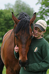 woman with Hannoveraner horse