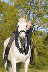 woman rides Hanoverian horse