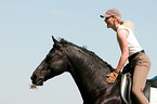woman rides Hanoverian