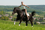 woman rides Hanoverian
