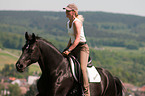woman rides Hanoverian