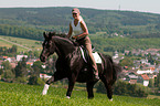 woman rides Hanoverian