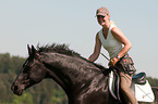 woman rides Hanoverian