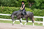 woman rides Hanoverian horse