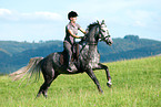 woman rides Hanoverian
