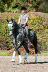woman rides Hanoverian