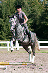 woman rides Hanoverian