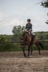 woman rides Hanoverian