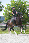 woman rides Hanoverian Horse
