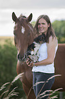 woman with Hanoverian Horse and Chihuahua