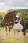 woman with Hanoverian Horse and Chihuahua