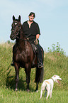 woman rides warmblood