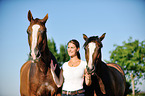 woman and 2 horses