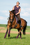 woman rides warmblood