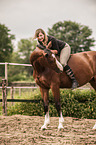woman rides warmblood