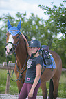 young woman with Holstein Horse