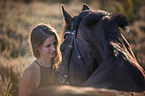 woman and holsteins horse