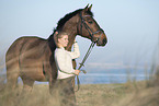 woman and holsteins horse