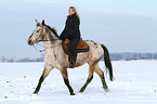 woman rides crossbreed