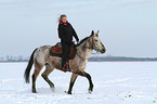 woman rides crossbreed