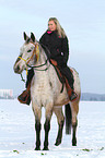 woman rides crossbreed