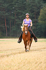 woman rides Icelandic horse