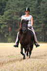 woman rides Icelandic horse