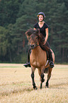 woman rides Icelandic horse