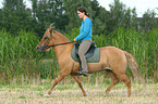 woman rides Icelandic horse