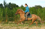 woman rides Icelandic horse